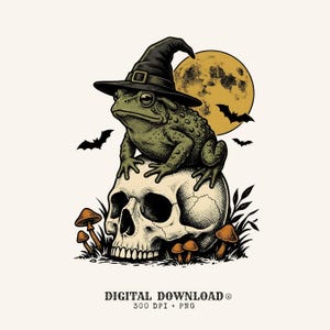 May include: A digital illustration of a green toad wearing a black witch hat, perched atop a human skull. The scene includes a large yellow moon, flying bats, and small mushrooms at the base. Text at the bottom reads: DIGITAL DOWNLOAD 300 DPI + PNG.