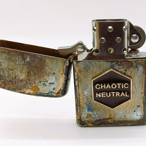 Unique Distressed "Chaotic Neutral" Flint Lighter   2.25" x 1.44" x .51"  All Metal Design  Uses Lighter Fluid (Not Included)