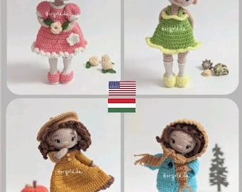 Può includere: Quattro bambole all'uncinetto con capelli castani e abiti diversi. Le bambole indossano un vestito rosa, un vestito verde, un vestito giallo e un cappotto blu con una sciarpa.