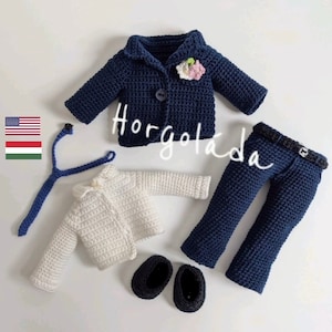 May include: A crocheted outfit for a doll, including a navy blue jacket with a flower embellishment, a white cardigan, navy blue pants, and black shoes. The text "Horgoláda" is visible in the image.