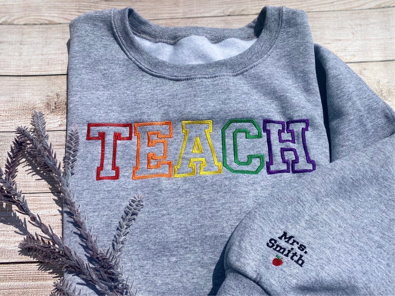 Custom embroidered Teacher sweatshirt with name on sleeves