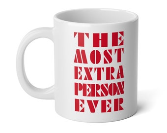 May include: White ceramic mug with a red graphic that says "The Most Extra Person Ever".