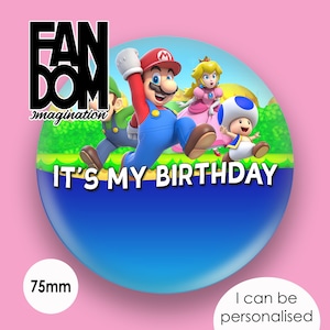 May include: A 75mm round button featuring Mario, Luigi, Peach, and Toad from the Super Mario Bros. video game series. The button has a blue background with green grass and a white banner that reads "It's My Birthday".