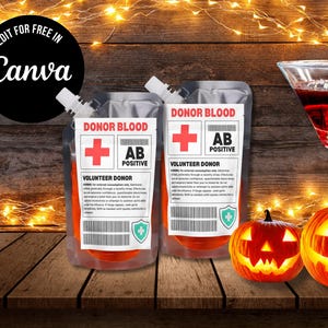 May include: Two plastic pouches labeled "Donor Blood" with a red cross and "AB Positive" text. The pouches are filled with an orange liquid. Two carved pumpkins and a cocktail glass are also in the image. The text "Edit for Free in Canva" is in a black circle.