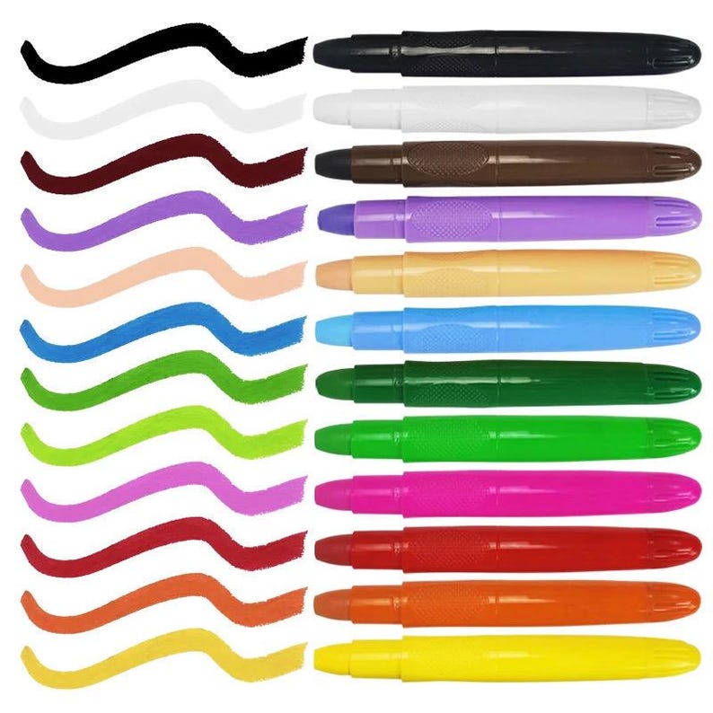 Twelve twist-up face paint crayons arranged in a row next to corresponding color swatches on a turquoise background. Crayon colors range from black and white to bright rainbow hues