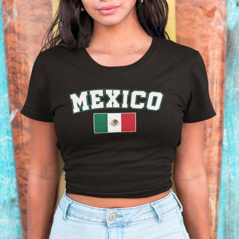 May include: Black cropped t-shirt with the word "MEXICO" in white letters and the Mexican flag printed below.