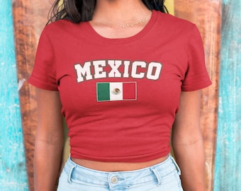May include: Red cropped t-shirt with the word "MEXICO" in white letters and the Mexican flag printed on the front.