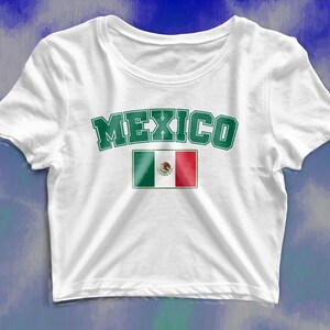 May include: White cropped t-shirt with the word "MEXICO" in green letters and the Mexican flag printed on the front.