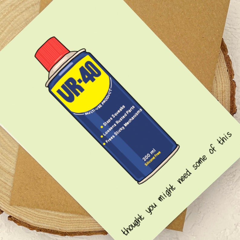 May include: A blue and yellow can of UR-40 multi-use product with the text "Stops Squeaks", "Loosens Rusted Parts", and "Frees Sticky Mechanisms". The can is labeled "200 ml Silicone Free". The text "thought you might need some of this" is written below the can.