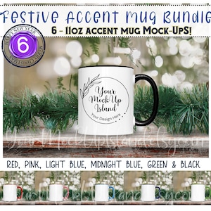 May include: Set of six 11-ounce white ceramic mugs with black accent rims. The mugs are arranged in a row on a wooden surface with a green garland behind them. The mugs are available in red, pink, light blue, midnight blue, green, and black.