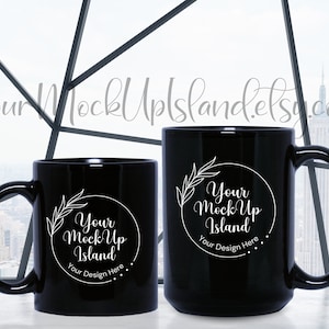 May include: Two black ceramic mugs with white text and a floral design. The text on the mugs reads "Your Mock Up Island" and "Your Design Here".