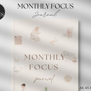 May include: A beige journal cover with the text "MONTHLY FOCUS Journal" in brown lettering. The cover features illustrations of a woman sitting at a table, a glass of water with a lemon slice, a cupcake, and other decorative elements.