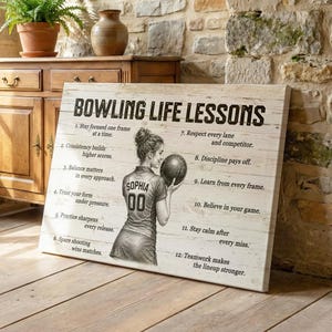 May include: A rectangular canvas wall art piece featuring a black and white sketch of a bowler holding a ball, with the text "BOWLING LIFE LESSONS" and a numbered list of twelve motivational phrases printed on a light wood-grain background.
