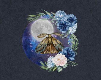 May include: A navy blue t-shirt with a watercolor illustration of a moth flying in front of a full moon with blue and white flowers.