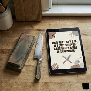 May include: A kitchen scene with a knife, sharpening stone, and a tablet. The tablet displays the text "YOUR KNIFE ISN'T BAD, IT'S JUST UNLOVED: A BEGINNER'S GUIDE TO SHARPENING". The knife has a wooden handle and a worn blade. The sharpening stone is rectangular.