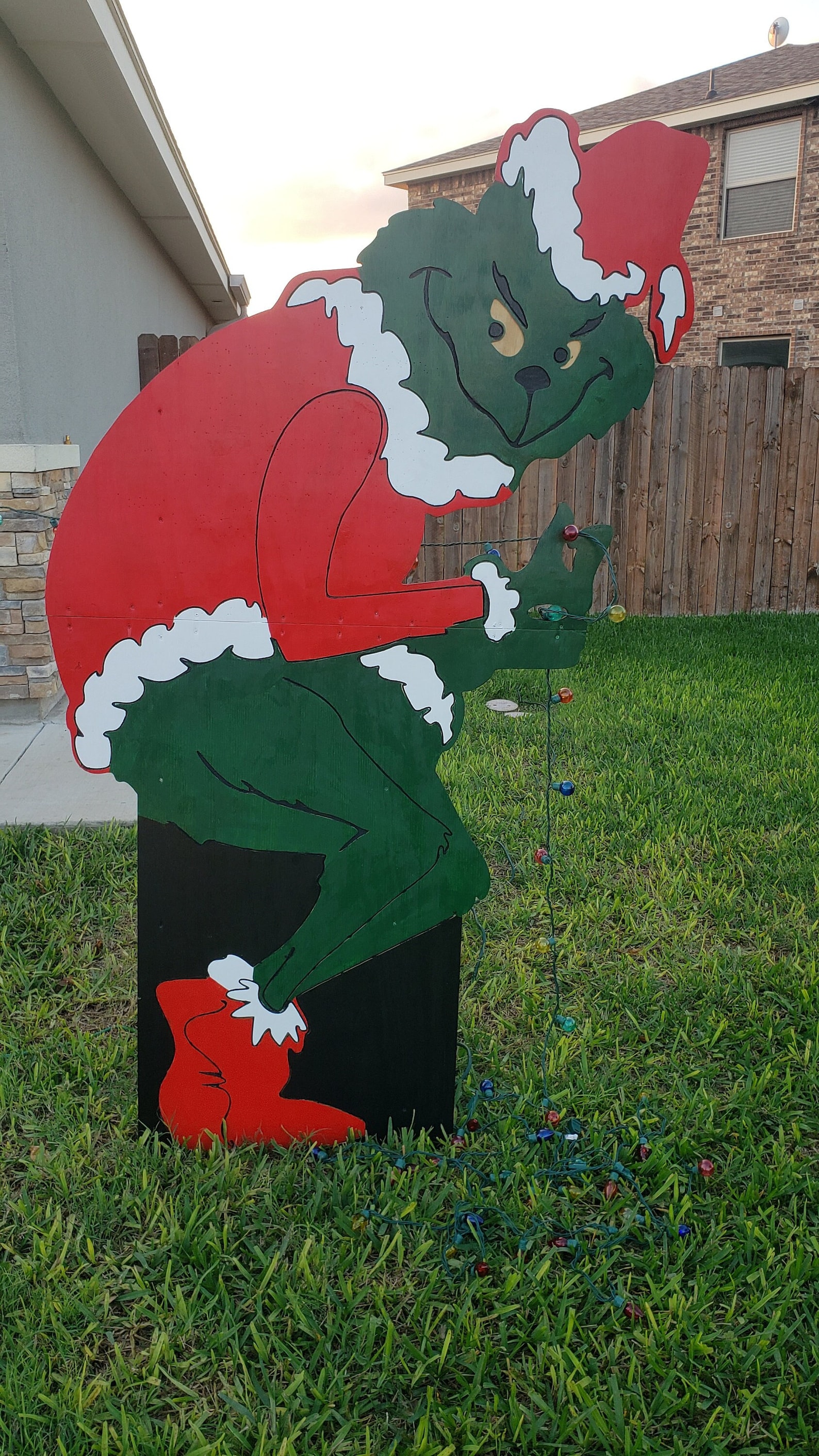 Grinch Taking Down Lights