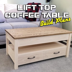 May include: A light-coloured wooden lift-top coffee table with two drawers. The tabletop is a lighter shade of wood, and the frame is a lighter colour. The text "LIFT TOP COFFEE TABLE Build Plans" is displayed in the image.