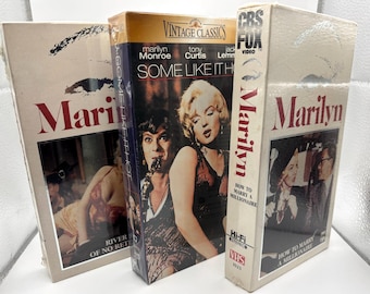 Tre (3) nuove cassette VHS di Marilyn Monroe sigillate. - "Come sposare un milionario", "Il fiume senza ritorno" e "A qualcuno piace caldo" Spedizione gratuita.