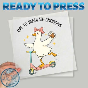 May include: A white square graphic with a cartoon duck riding a pink scooter and holding a coffee cup. Text reads "OFF TO REGULATE EMOTIONS" and "READY TO PRESS". The duck has a pink bow and is surrounded by yellow stars.