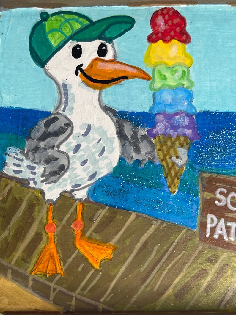 May include: A whimsical painting of a seagull wearing a green cap, holding a towering ice cream cone with scoops of red, yellow, green, blue, and purple. The seagull has an orange beak and feet. The background shows a blue sea and a wooden dock.