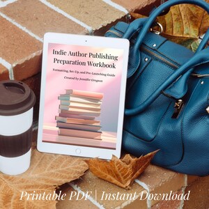 May include: A digital tablet displays the cover of a workbook titled "Indie Author Publishing Preparation Workbook." A reusable coffee cup, a teal handbag, and autumn leaves are also in the image. The text "Printable PDF | Instant Download" is at the bottom.