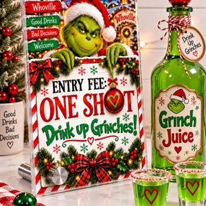 May include: A clear acrylic sign featuring the Grinch, text reading "ENTRY FEE: ONE SHOT Drink up Grinches!", and holiday graphics. Beside it, a green glass bottle labeled "Grinch Juice" with a red topper and two shot glasses filled with green liquid.