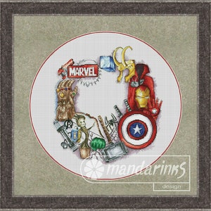 May include: A white circle with a red border, featuring a variety of Marvel characters and symbols, including Iron Man, Captain America, Thor, and the Infinity Gauntlet. The text "MARVEL" is visible in the center of the circle.