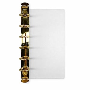May include: A gold-colored binder with a white paper insert. The binder has a series of gold rings and a clasp to hold the paper in place. The paper is plain and white, providing a clean background.