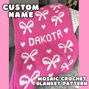 May include: A pink mosaic crochet blanket with white bow and heart designs. The name "DAKOTA" is in white block letters. The blanket has the text "CUSTOM NAME" and "MOSAIC CROCHET BLANKET PATTERN" in white.