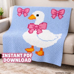 May include: A crocheted blanket with a white goose design, pink bows, and orange feet, set against a light blue backdrop. The blanket is draped over a sofa. The text "INSTANT PDF DOWNLOAD" is visible. The blanket is likely made of wool or a similar yarn.