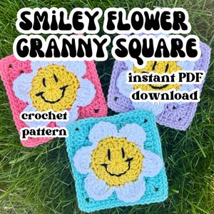 May include: Three crochet granny squares in pink, blue, and lilac, each featuring a smiley face flower design. The flowers have yellow centres and white petals. Text on the image reads "SMILEY FLOWER GRANNY SQUARE", "crochet pattern", and "instant PDF download".