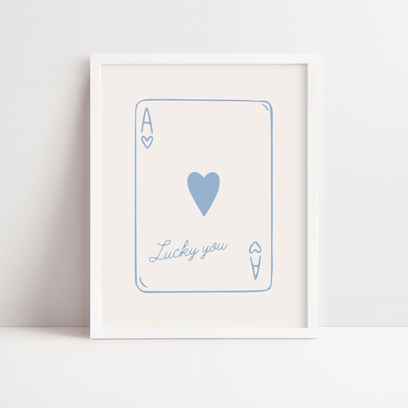 May include: A printable art print featuring a blue illustration of the ace of hearts playing card with the text "Lucky you" written below the card.