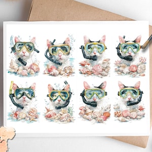 May include: A white card featuring watercolor illustrations of cats wearing diving masks and snorkels, surrounded by seashells and coral. The cats have various eye colors and snorkel mask colors. The card has the text "Pixie Decoupage" in the lower left corner.