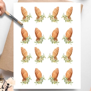 May include: Vellum decoupage paper featuring watercolor illustrations of praying hands with olive branches. The hands are a warm, light brown color, and the olive branches are green. The paper has a white background.