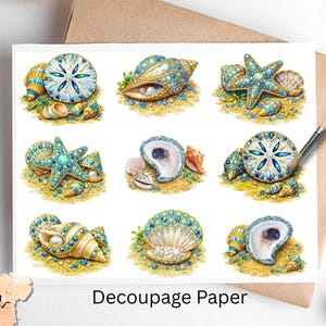 May include: Decoupage paper featuring nine detailed illustrations of seashells, starfish, and sand dollars with blue and gold accents. The text "Decoupage Paper" is printed on the paper. The Pixie Decoupage logo is in the lower left corner.