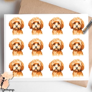 May include: A white card featuring a repeating pattern of watercolor illustrations of a Cavapoo puppy. The puppy has fluffy, light brown fur and a sweet expression. The card is placed on a brown envelope with a paintbrush and a spool of thread in the background.