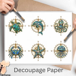 May include: A sheet of decoupage paper featuring six distinct illustrations of marine animals, including a sea turtle, dolphin, octopus, crab, starfish, and jellyfish, each centered over a gold compass rose with cardinal direction markers.