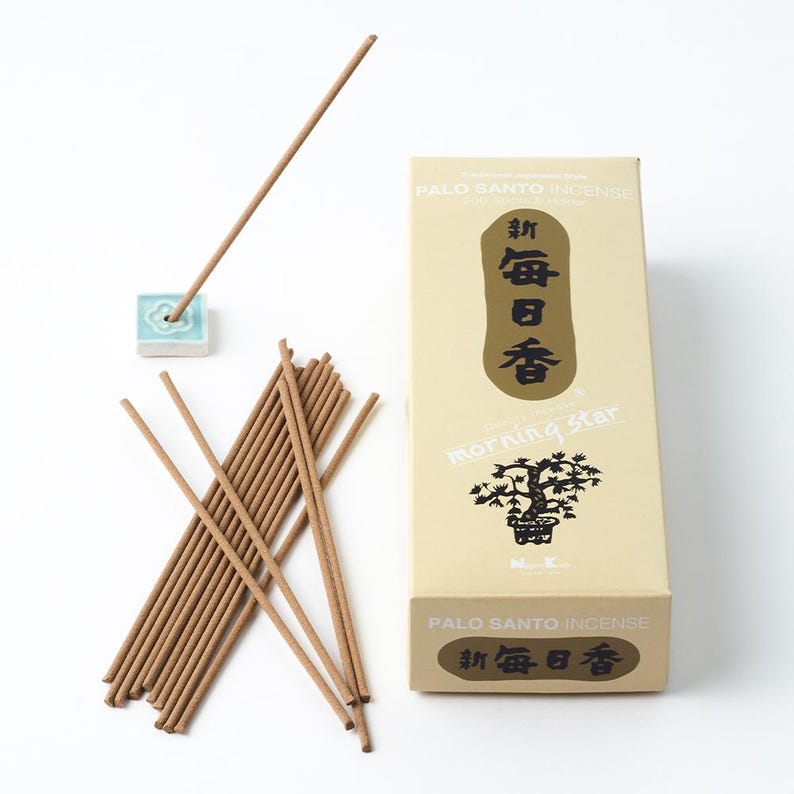May include: A box of Morning Star Palo Santo incense sticks with a light brown background and black text. The box features a black and white illustration of a bonsai tree. The text on the box reads "Morning Star" and "Palo Santo Incense". The box is open and a bundle of incense sticks is visible. The incense sticks are brown and have a light brown holder.