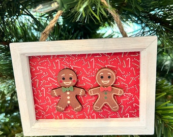 Handmade gingerbread men Christmas ornaments with candy canes