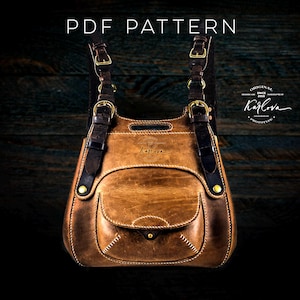 May include: A brown leather satchel bag with a flap closure and a front pocket. The bag has a dark brown strap and gold hardware. The bag is on a dark wood background.  PDF PATTERN.