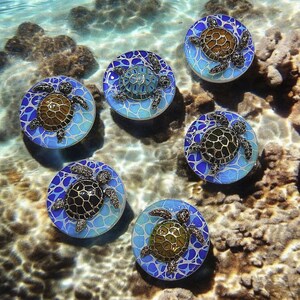 May include: Six decorative turtle-themed objects. Each circular object features a detailed turtle design in the center, surrounded by a mosaic-style pattern of blue and white. The objects are set against a backdrop of water and coral.