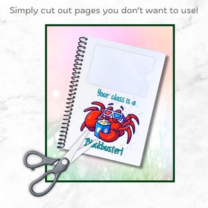May include: A white spiral bound notebook with a red crab wearing 3D glasses and holding a bucket of popcorn. The notebook has a clear plastic pocket on the front cover and the text "Your class is a blockbuster!" printed on the front cover.