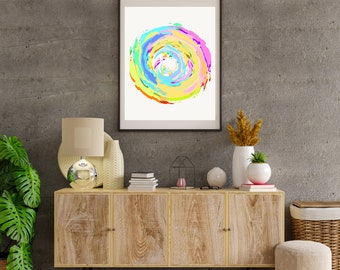 May include: A framed abstract painting with a colorful swirl design in shades of pink, blue, yellow, and green. The painting is hanging on a gray concrete wall above a wooden cabinet with three drawers. The cabinet is decorated with a lamp, vases, and other decorative items.