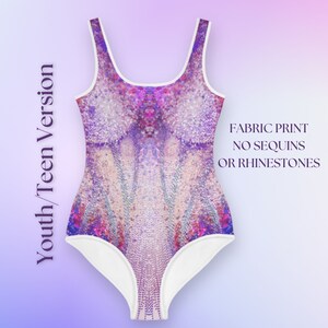 May include: A white swimsuit with a purple and pink iridescent print. The swimsuit has a scoop neck and a racerback style. The text "FABRIC PRINT NO SEQUINS OR RHINESTONES" is printed on the right side of the image.