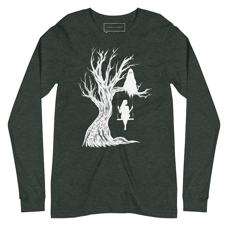 May include: A dark green long-sleeve t-shirt with a white silhouette of a tree with a ghost and a person on a swing. The tree is covered in white text.