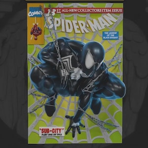 May include: A Marvel Comics Spider-Man comic book cover featuring the character in a black suit with a white spider emblem, crouching against a light green web background. The text reads 13th All-New Collectors Item Issue, The Legend of the Black Knight, and Sub-City Part One of Two.