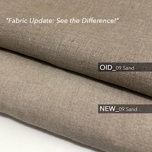 May include: Close-up of two fabric swatches, one labeled "OID_09 Sand" and the other labeled "NEW_09 Sand". The fabric is a light brown color with a woven texture.