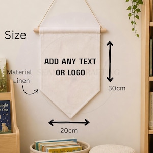 May include: A cream-coloured linen wall banner with a wooden dowel and hanging string. The banner features the black text ADD ANY TEXT OR LOGO. It measures 30cm in height and 20cm in width, as indicated by the black arrows and measurement labels.