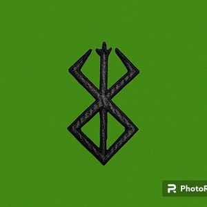 Peut inclure: Symbole noir et blanc avec un design géométrique, ressemblant à une lettre 'X' stylisée avec quatre points.