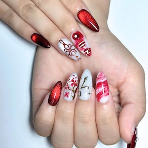 Handmade K-pop concert inspired press on nails featuring burgundy chrome gradients, glossy marble nail art, elegant floral details, concertcore aesthetic, and luxury reusable gel nails perfect for concerts, fan meetings, and music festivals.